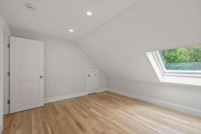 176 Palmer Ave Unit 2, Falmouth, MA 02540 - additional living space with a skylight, lofted ceiling, light wood finished floors, recessed lighting, and baseboards