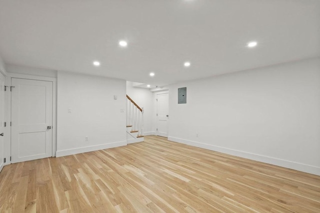 176 Palmer Ave Unit 2, Falmouth, MA 02540 - finished below grade area featuring recessed lighting, stairway, baseboards, light wood-style flooring, and electric panel