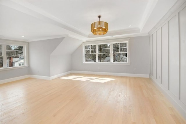 bonus room with a chandelier, baseboards, light wood-style floors, and recessed lighting