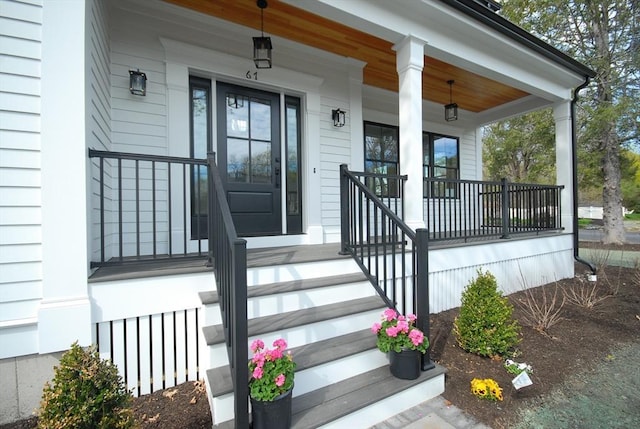 entrance to property featuring a porch