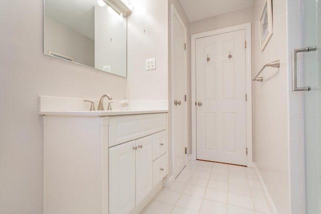 57 Mark Dr, Raynham, MA 02767 - full bath featuring vanity, baseboards, tile patterned flooring, and a shower with door