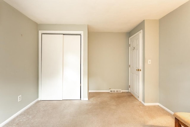 57 Mark Dr, Raynham, MA 02767 - unfurnished bedroom with light colored carpet, baseboards, and a closet