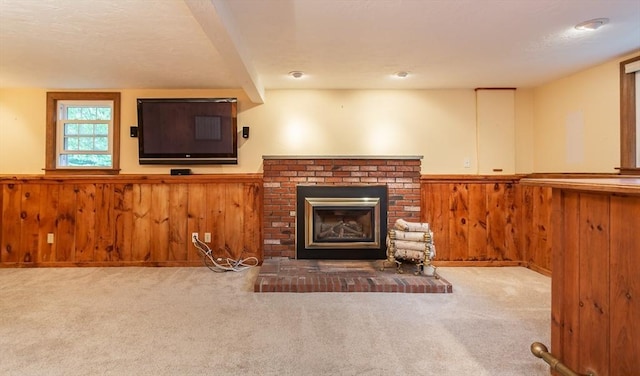 57 Mark Dr, Raynham, MA 02767 - unfurnished living room with a wainscoted wall, a fireplace, carpet flooring, and wooden walls