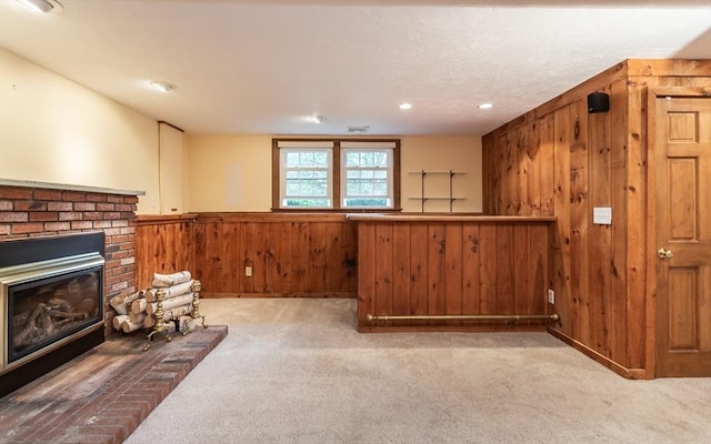 57 Mark Dr, Raynham, MA 02767 - unfurnished room with wooden walls, a brick fireplace, carpet floors, a wainscoted wall, and recessed lighting