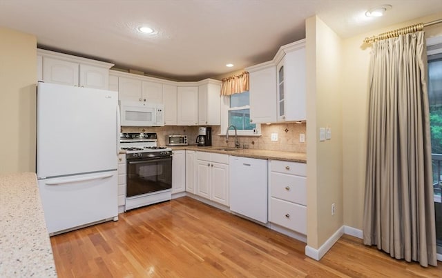 57 Mark Dr, Raynham, MA 02767 - kitchen featuring white appliances, a sink, light wood-type flooring, white cabinetry, and recessed lighting