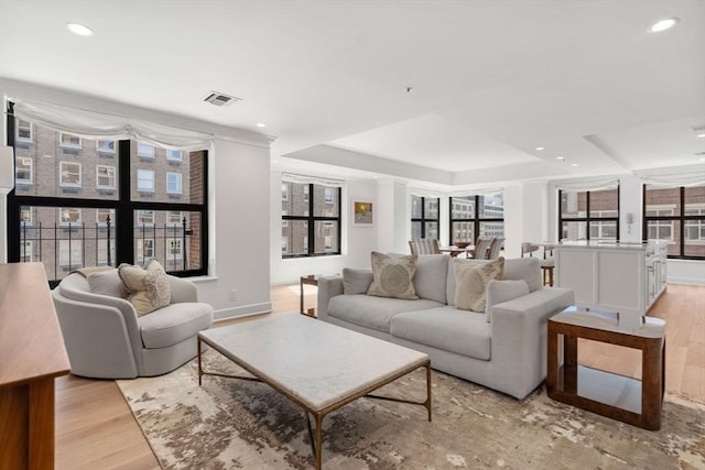 300 Boylston St Unit 907, Boston, MA 02116 - living room with recessed lighting, a raised ceiling, light wood finished floors, and baseboards