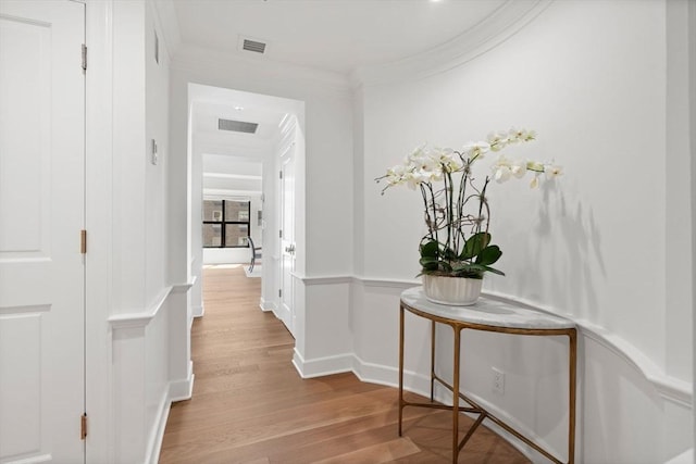 300 Boylston St Unit 907, Boston, MA 02116 - corridor featuring ornamental molding, wood finished floors, and visible vents