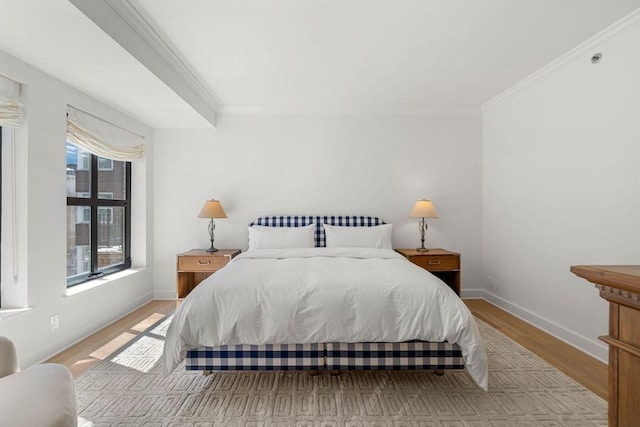 300 Boylston St Unit 907, Boston, MA 02116 - bedroom featuring crown molding, baseboards, and light wood-style floors