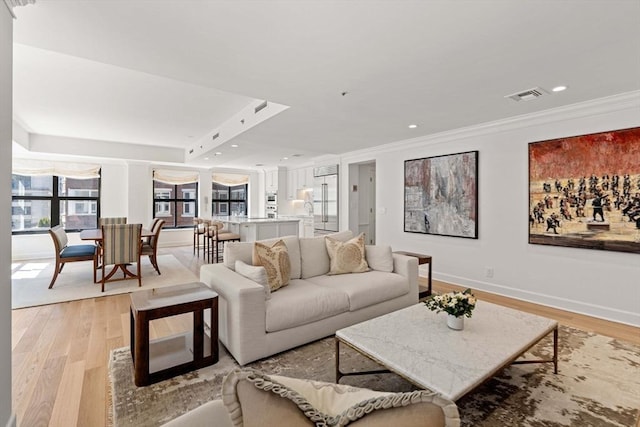 300 Boylston St Unit 907, Boston, MA 02116 - living room with light wood finished floors, recessed lighting, baseboards, visible vents, and ornamental molding