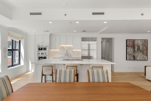 300 Boylston St Unit 907, Boston, MA 02116 - kitchen with baseboards, crown molding, and stainless steel appliances