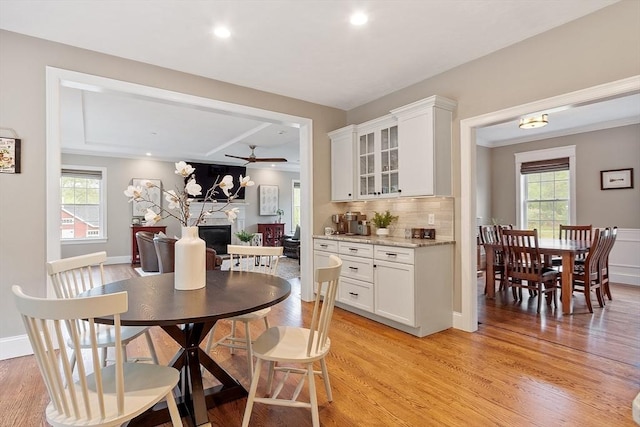 57 Houghton Farm Ln, Bolton, MA 01740 - dining space with a fireplace, healthy amount of natural light, ceiling fan, light wood-style floors, and recessed lighting