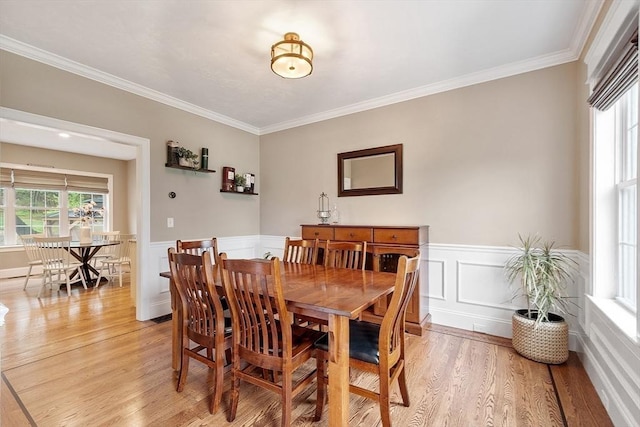 57 Houghton Farm Ln, Bolton, MA 01740 - dining space featuring light wood-style flooring, crown molding, wainscoting, and a decorative wall
