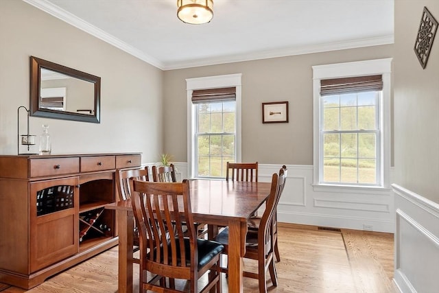 57 Houghton Farm Ln, Bolton, MA 01740 - dining area featuring light wood-style flooring, ornamental molding, and wainscoting