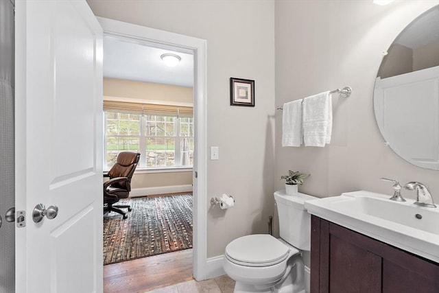 57 Houghton Farm Ln, Bolton, MA 01740 - bathroom featuring baseboards, vanity, toilet, and wood finished floors