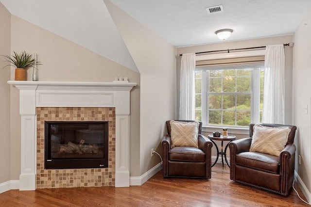 57 Houghton Farm Ln, Bolton, MA 01740 - living area featuring wood finished floors, baseboards, and a tiled fireplace