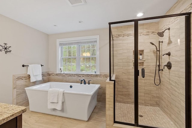 57 Houghton Farm Ln, Bolton, MA 01740 - full bath with a shower stall, a freestanding tub, tile walls, vanity, and wainscoting