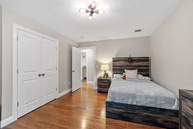 57 Houghton Farm Ln, Bolton, MA 01740 - bedroom featuring light wood-style floors, baseboards, and a closet