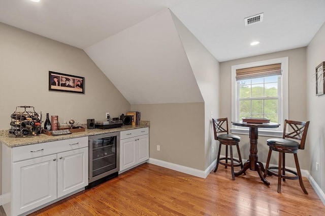 57 Houghton Farm Ln, Bolton, MA 01740 - indoor dry bar featuring beverage cooler, light wood-type flooring, baseboards, vaulted ceiling, and recessed lighting