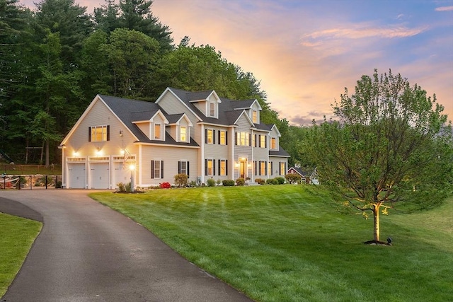 57 Houghton Farm Ln, Bolton, MA 01740 - view of front of property featuring driveway, a front lawn, and an attached garage