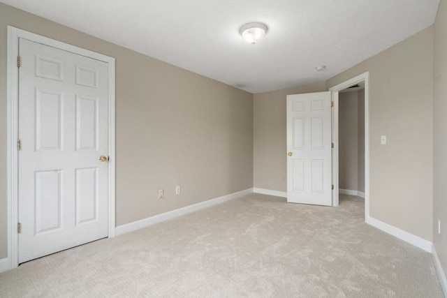 unfurnished bedroom with light carpet