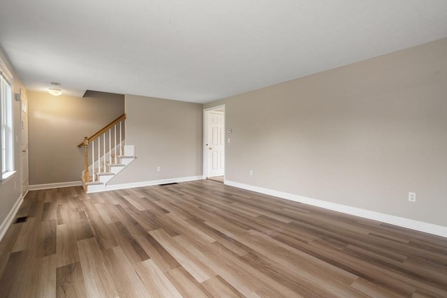 unfurnished living room with hardwood / wood-style flooring