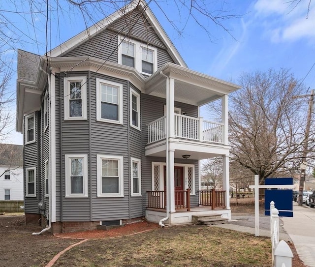 view of front of home with a balcony and covered porch