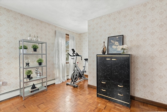 workout room with parquet floors, baseboards, and wallpapered walls