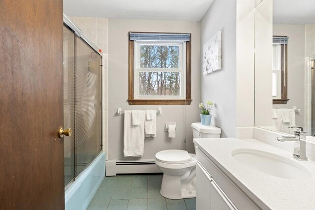 full bath featuring toilet, shower / bath combination with glass door, a baseboard radiator, tile patterned flooring, and vanity