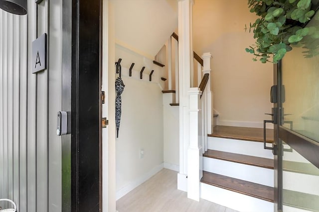 10 Wakefield Ave Unit A, Wakefield, MA 01880 - stairs with baseboards and wood finished floors