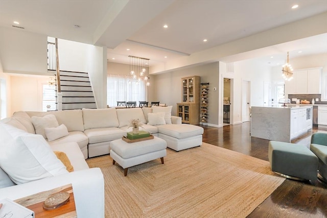 10 Wakefield Ave Unit A, Wakefield, MA 01880 - living room featuring a chandelier, wood finished floors, plenty of natural light, stairs, and recessed lighting