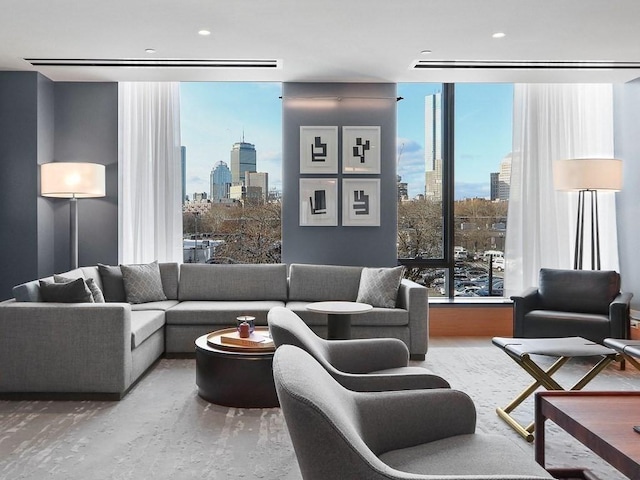 380 Harrison Ave Unit Ph1K, Boston, MA 02118 - living room featuring a skyline view and expansive windows