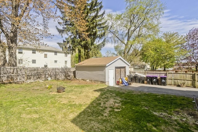 4 Columbia St, Holyoke, MA 01040 - view of yard with an outbuilding, a storage shed, a patio area, a fire pit, and a fenced backyard