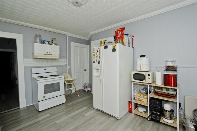 4 Columbia St, Holyoke, MA 01040 - kitchen with white appliances, an ornate ceiling, under cabinet range hood, crown molding, and light wood-style flooring