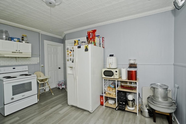 4 Columbia St, Holyoke, MA 01040 - kitchen featuring ornamental molding, white appliances, light wood-style flooring, and under cabinet range hood