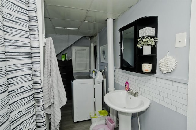 4 Columbia St, Holyoke, MA 01040 - full bath featuring washer / clothes dryer and decorative backsplash
