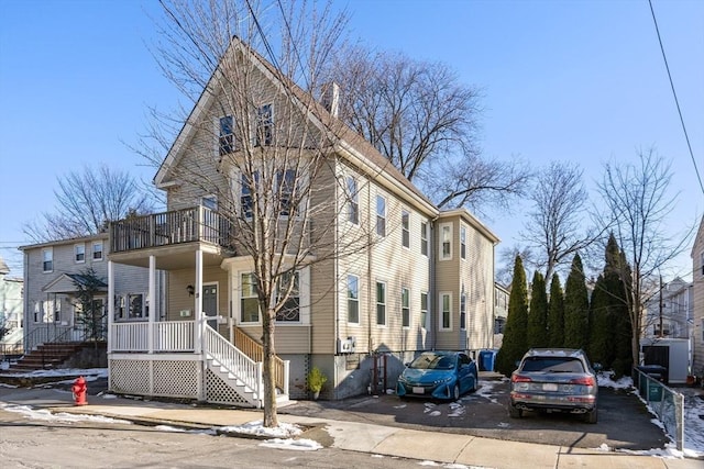 view of front facade with a porch and a balcony