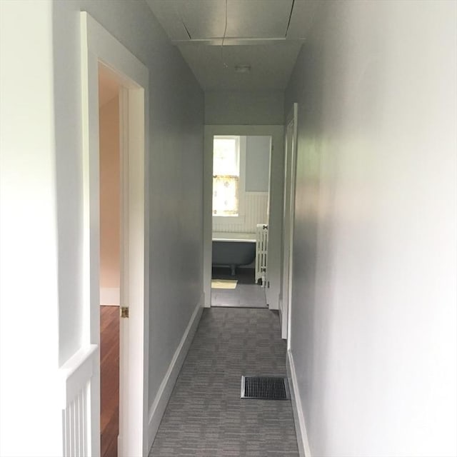 11 Moynan St, New Bedford, MA 02745 - corridor with attic access, baseboards, and dark colored carpet