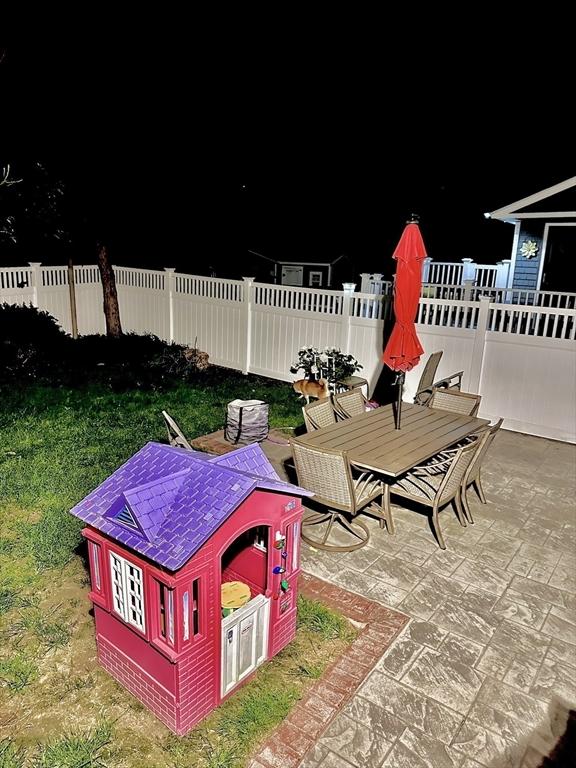 11 Moynan St, New Bedford, MA 02745 - patio at night featuring a patio area