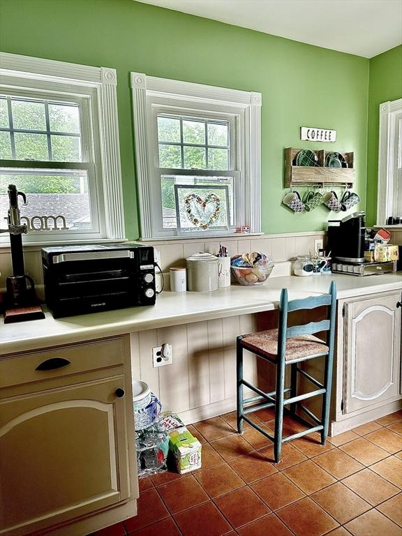 11 Moynan St, New Bedford, MA 02745 - kitchen featuring tile patterned flooring and light countertops