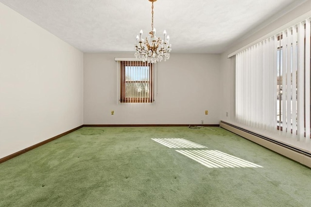 11 Ocean View Dr, Gloucester, MA 01930 - carpeted spare room featuring a baseboard heating unit, baseboards, and a chandelier
