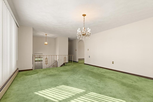 11 Ocean View Dr, Gloucester, MA 01930 - carpeted empty room with a baseboard radiator, arched walkways, a chandelier, and baseboards