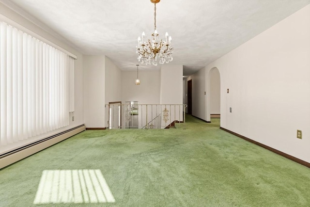 11 Ocean View Dr, Gloucester, MA 01930 - carpeted spare room featuring baseboard heating, baseboards, a chandelier, and arched walkways