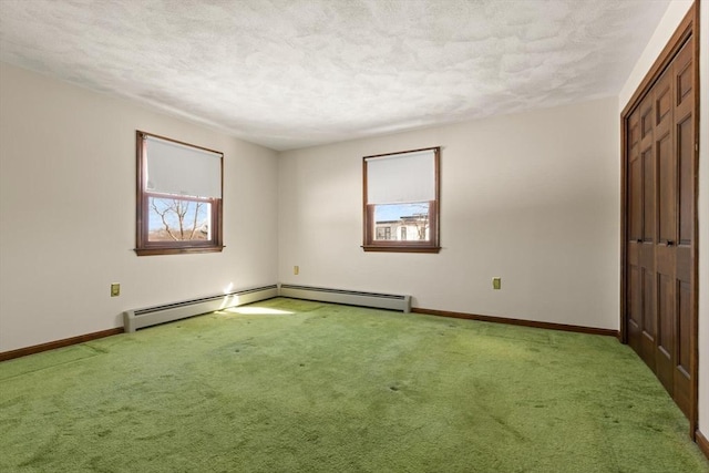 11 Ocean View Dr, Gloucester, MA 01930 - unfurnished bedroom featuring carpet floors, baseboards, a textured ceiling, and a baseboard heating unit