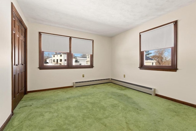 11 Ocean View Dr, Gloucester, MA 01930 - carpeted spare room with healthy amount of natural light, baseboards, and a baseboard radiator