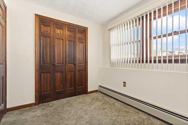 11 Ocean View Dr, Gloucester, MA 01930 - unfurnished bedroom featuring baseboard heating, carpet floors, and multiple windows