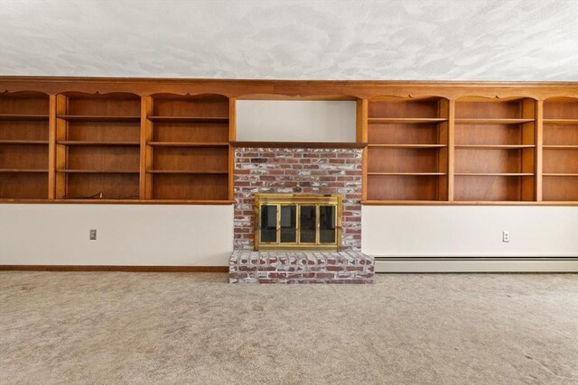 11 Ocean View Dr, Gloucester, MA 01930 - unfurnished living room featuring carpet floors, baseboard heating, a brick fireplace, and baseboards