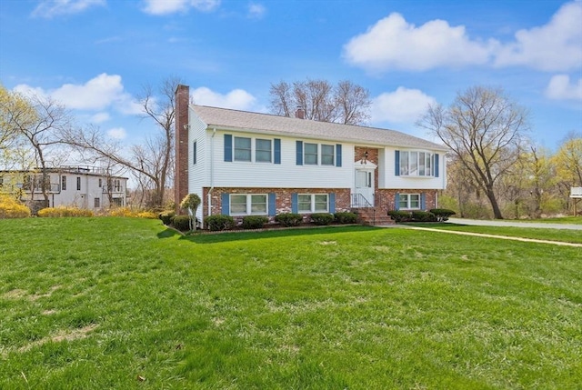 11 Ocean View Dr, Gloucester, MA 01930 - raised ranch with a chimney, brick siding, and a front yard