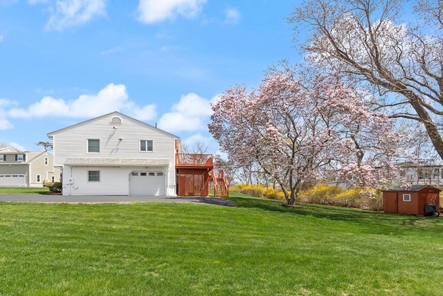 11 Ocean View Dr, Gloucester, MA 01930 - view of home's exterior featuring stairway, a storage shed, a garage, and a lawn