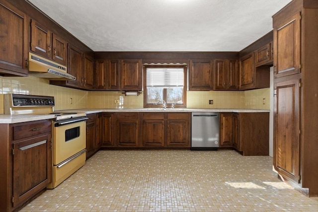 11 Ocean View Dr, Gloucester, MA 01930 - kitchen with dishwasher, white electric range oven, under cabinet range hood, tasteful backsplash, and light countertops