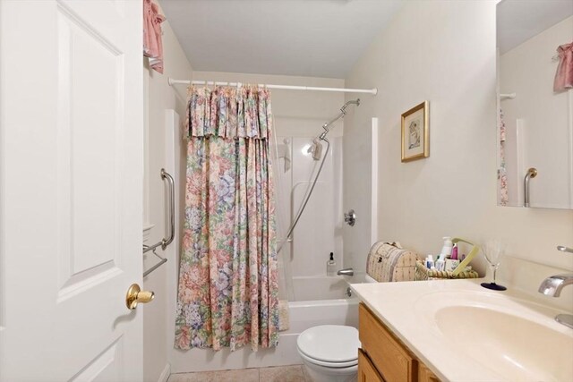 bathroom with shower / bathtub combination with curtain, vanity, toilet, and tile patterned flooring